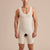 Marena Recovery style MHB2 men sleeveless zipperless bodysuit, front pose view in beige