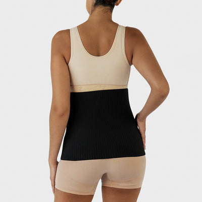 Marena Recovery style AICAB12 abdominal binder back view, shown in black on female model.