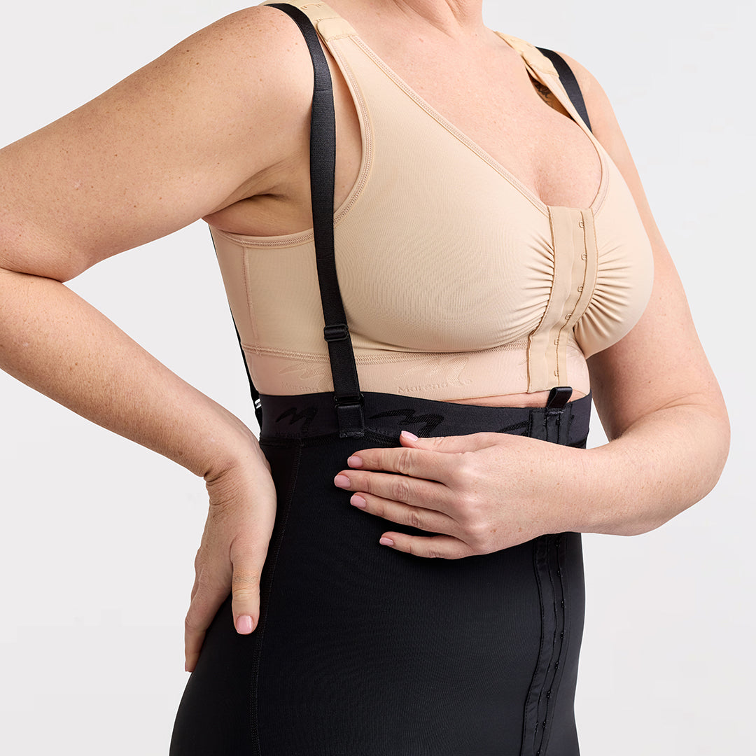 Marena Recovery style LIPSGHE, Lipedema Post-Surgical Girdle with Hook-&-Eye in black, strap detail view, shown from the front on a female model.