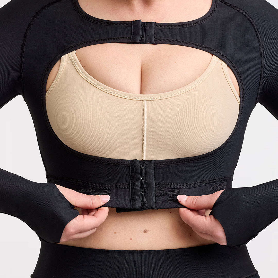 Marena Recovery style LIVOLH Lipedema Post-Surgical Open Bust Vest With Hand Coverage, in black, front detail view shown on a female model.