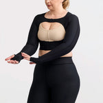 Marena Recovery style LIVOLH Lipedema Post-Surgical Open Bust Vest With Hand Coverage, in black, front view showing hand coverage, on a female model.