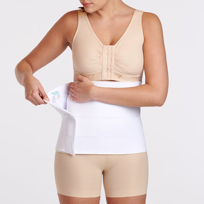Marena Recovery style AB4F7 abdominal binder shown from the front with female model opening the binder.