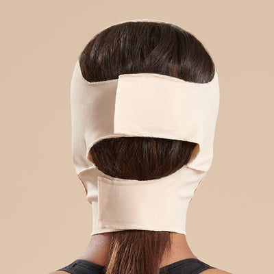 Marena Recovery style FM300-B medium coverage, mid neck length compression face mask back view in beige shown on female model