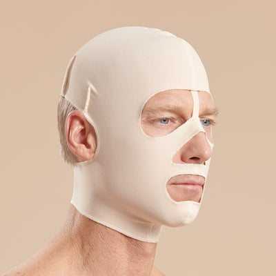 Marena Recovery style FM500 full coverage post-surgical compression face mask side view in beige, shown on male model