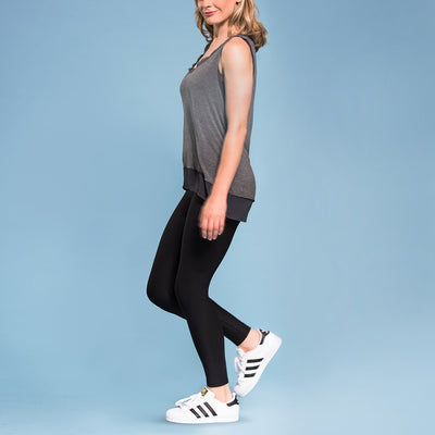 Marena Shape style ME-621 High-waist compression legging side pose, in black worn with grey tank top and sneakers