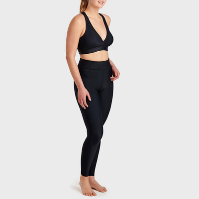 Marena Maternity™ Post-Pregnancy compression leggings, side pose view, shown in black
